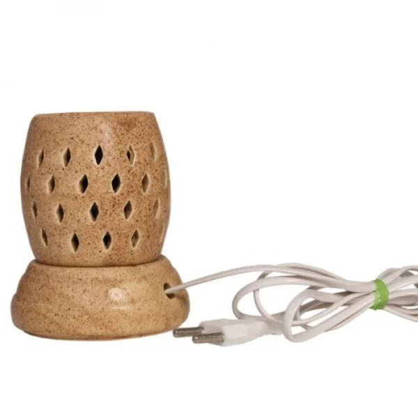 Ceramic electric aroma diffuser with carved holes and attached white power cord